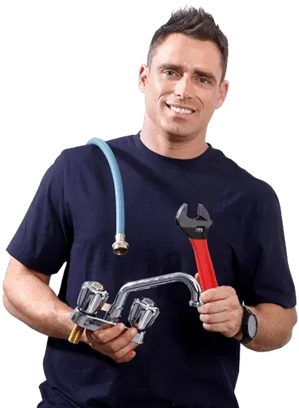 Emergency plumber working on a burst pipe at night